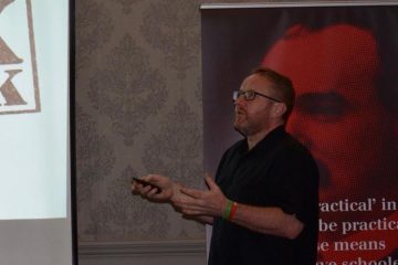 Dr Stevie Nolan speaks at an "Organise for €15" public meeting. Credit: Trademark / Facebook.