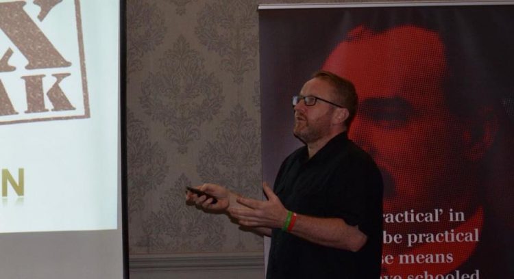 Dr Stevie Nolan speaks at an "Organise for €15" public meeting. Credit: Trademark / Facebook.